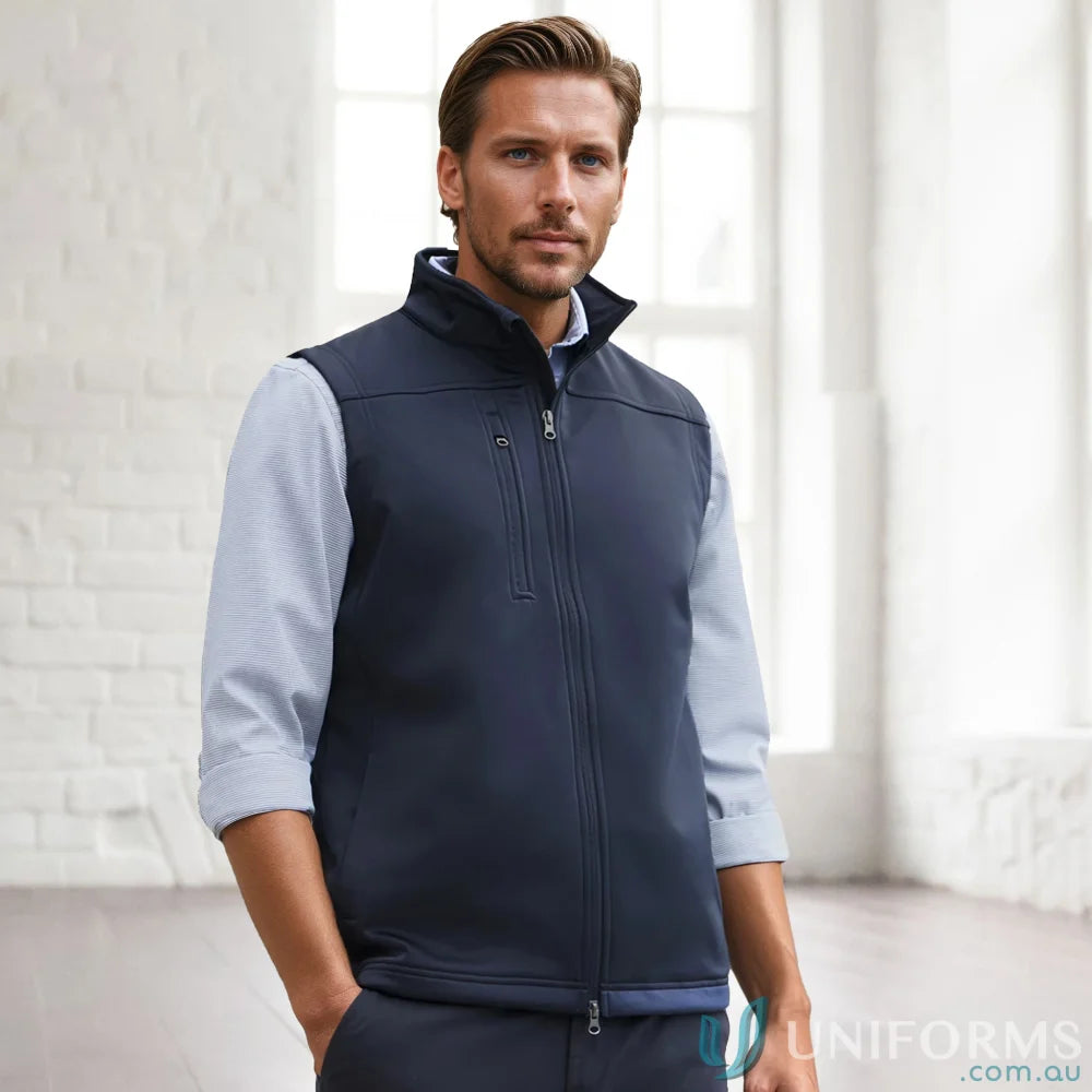 Man wearing navy U:Tech SoftShell Vest, a mens softshell vest to stay warm and look cool
