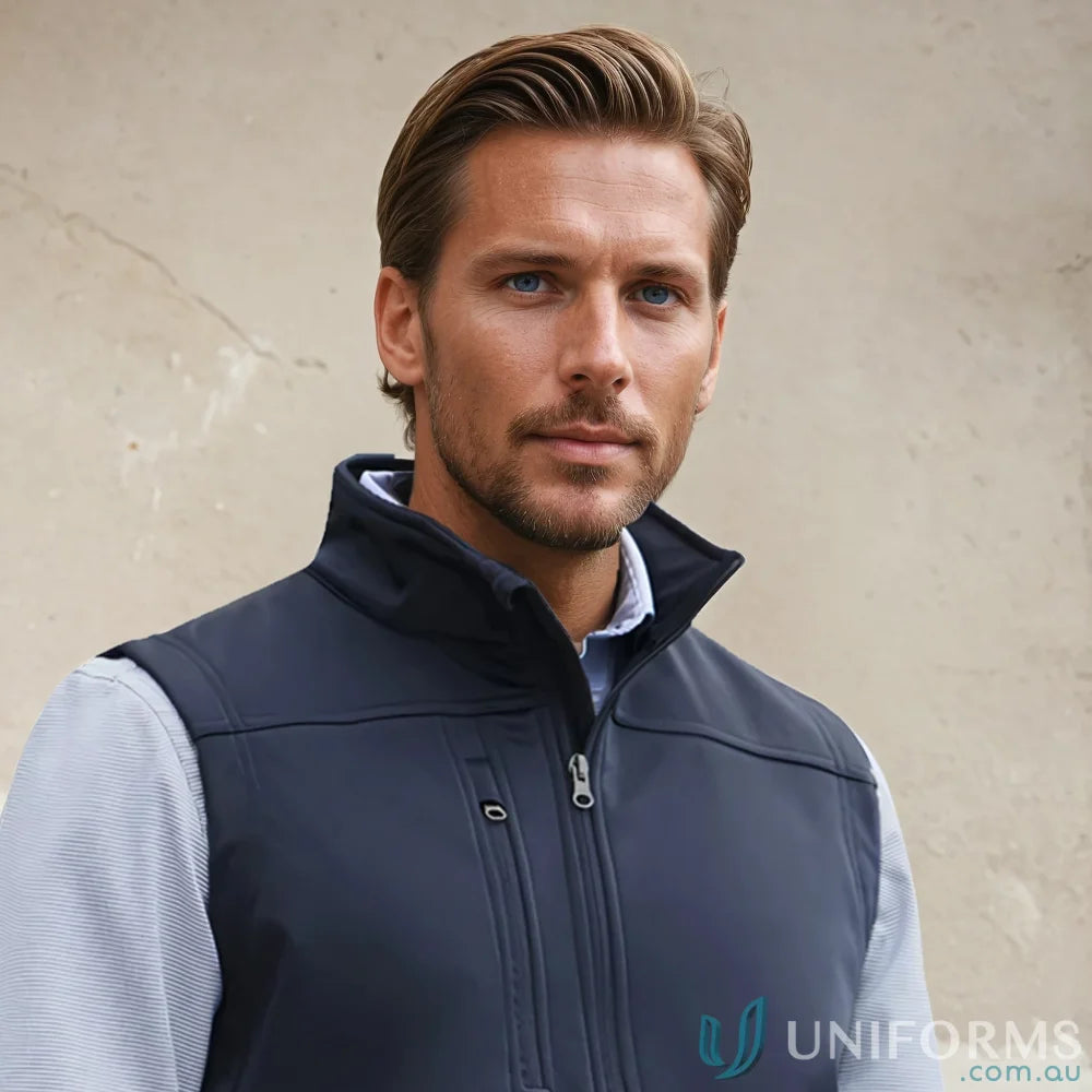 Man wearing navy U:Tech SoftShell Vest, perfect mens softshell vest to stay warm