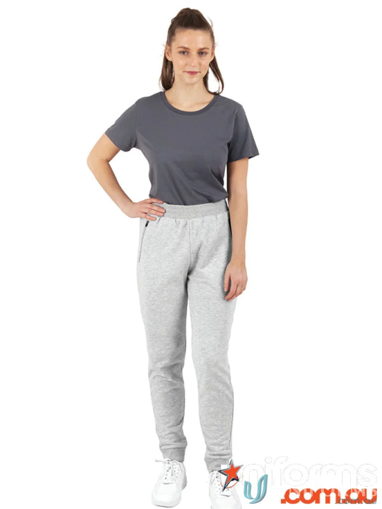 Woman wearing winning spirit adults French Terry track pants and gray t-shirt