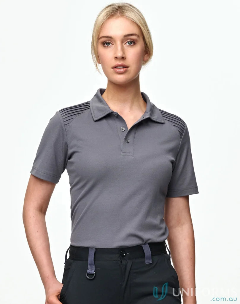 Blonde woman in grey unisex short sleeve Winning Spirit XStreet TrueDry Polo