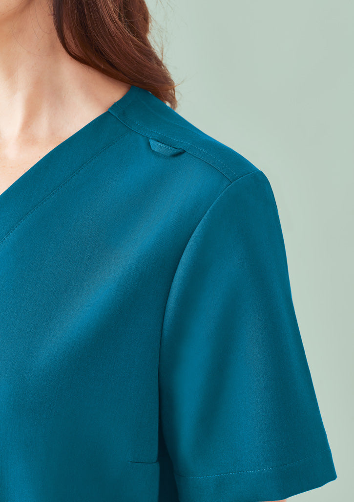 Teal Pulse V-Neck scrub top with v-neck, seams, utility loop to stay cool