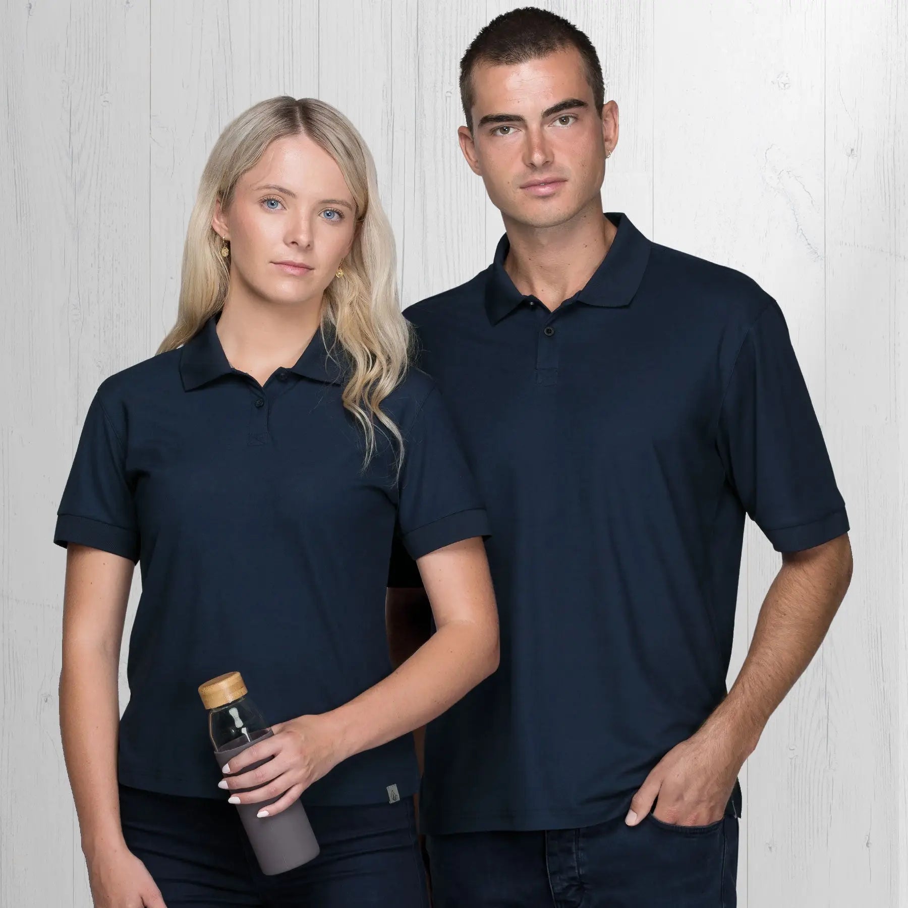 Two people in navy blue polo shirts from Life Mens polos gear for urban and outdoor style