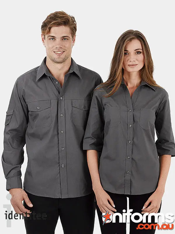 Two people modeling dark gray Identitee mens shirts and ladies polo styles for standout uniforms