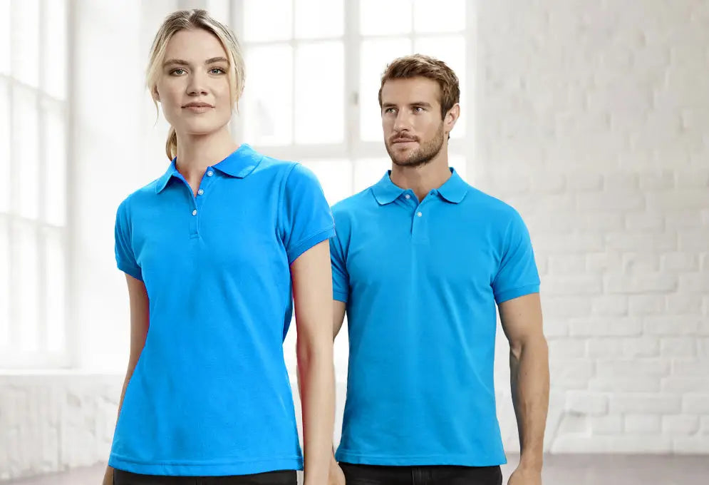 Two models wearing bright blue uniforms showcasing UNIFORMS business model change