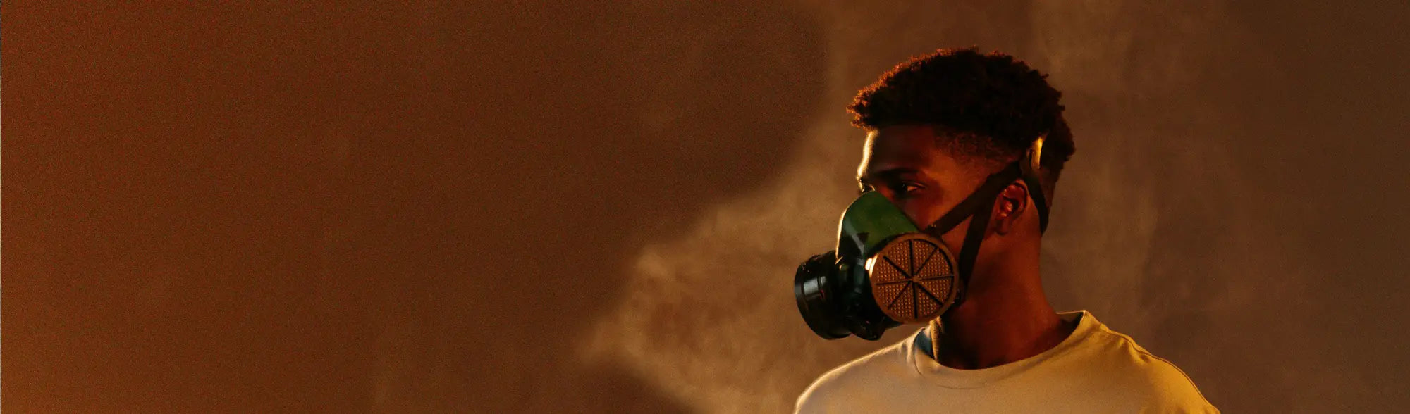 Man in a gas mask wearing high-performance protective disposable respirators