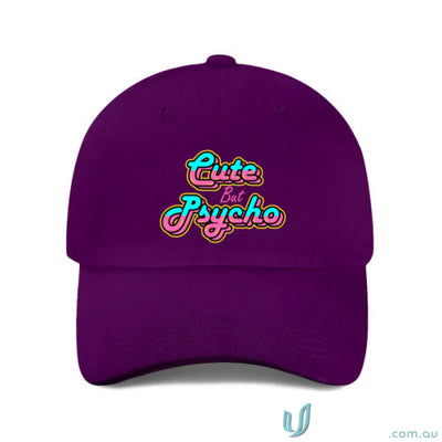 Purple baseball cap with cute but psycho in neon pink cyan on heavy brushed cotton