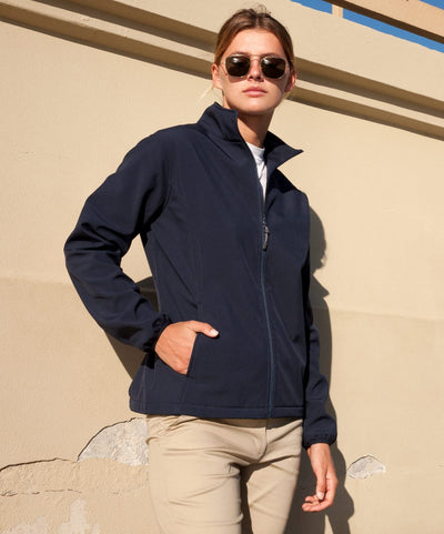 Navy blue softshell ladies alta jacket with full zipper and side pockets ideal for workwear and uniforms