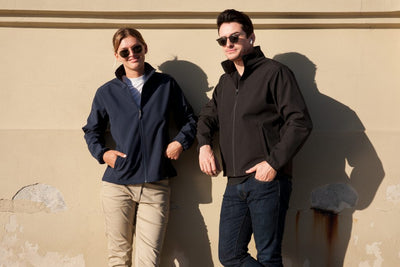 Navy blue ladies alta softshell jacket with high collar zip front and two pockets perfect for work uniforms and workwear