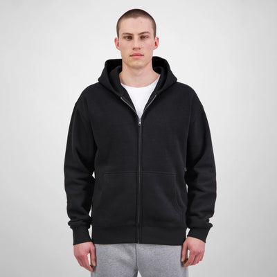 Person wearing a black hoodie on a white background
