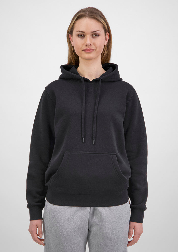 Person wearing a black hoodie and gray pants on a white background