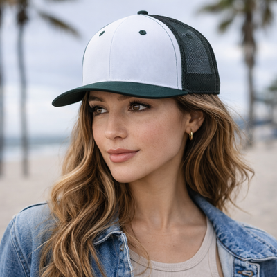 White and black trucker hat with mesh back and dark green brim made of premium twill for workwear or uniforms