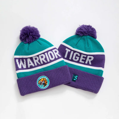 Teal and purple knitted pompom beanie with white warrior and tiger lettering and team logos perfect for work uniforms