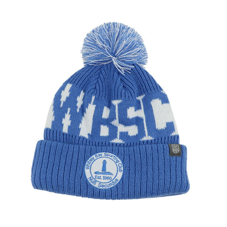 Blue knitted pompom beanie with white wbsl lettering and whitby bay sporting club patch ideal for workwear uniforms