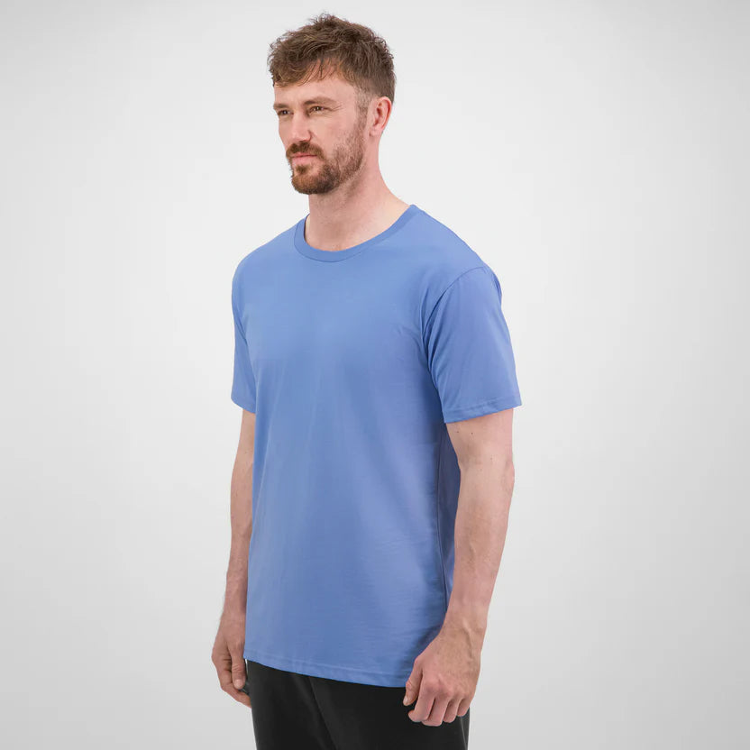Man wearing a blue t-shirt against a white background