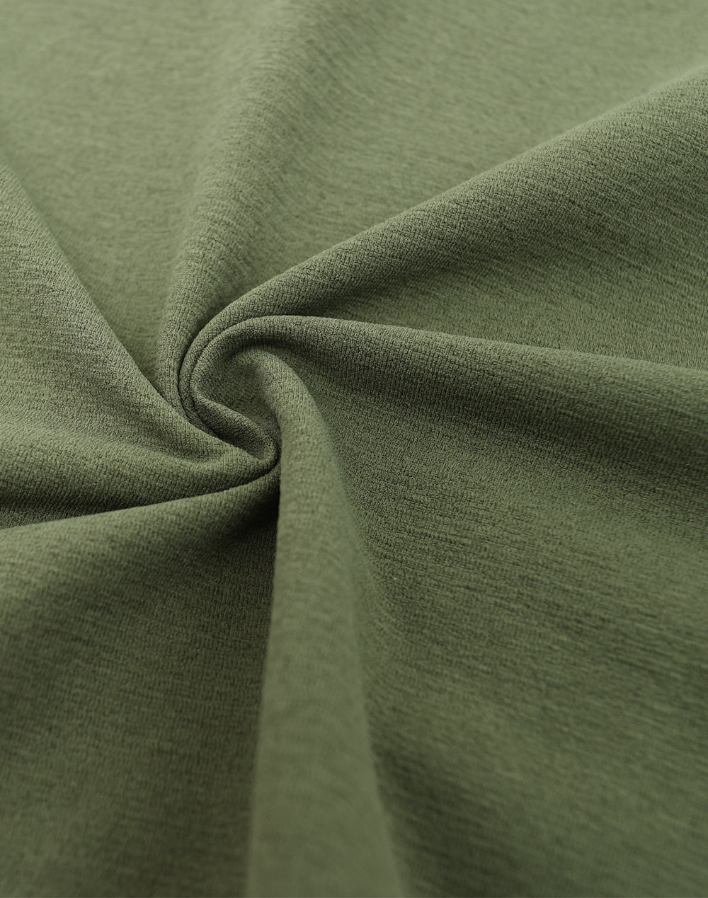 Close-up of green fabric with folds