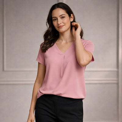 Soft pink kayla v neck pleat blouse with short sleeves made of lightweight fabric ideal for work uniforms and workwear