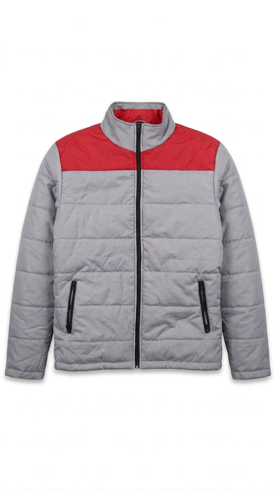 A gray quilted puffer jacket with a contrasting red yoke across the chest, a black front zipper, and black zippered hand pockets, shown against a plain white background.