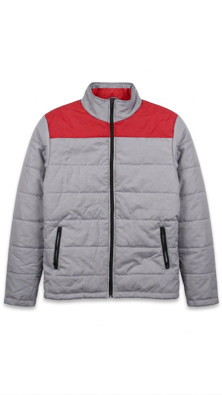 A gray quilted puffer jacket with a contrasting red yoke across the chest, a black front zipper, and black zippered hand pockets, shown against a plain white background.