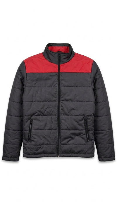 A colorblock puffer jacket with a black body and a red yoke across the chest, featuring a stand-up collar and front zipper closure.