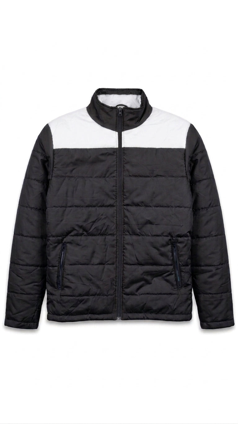 A black and white colorblock puffer jacket with a full-zip front, stand-up collar, and zippered hand pockets, shown against a plain white background.