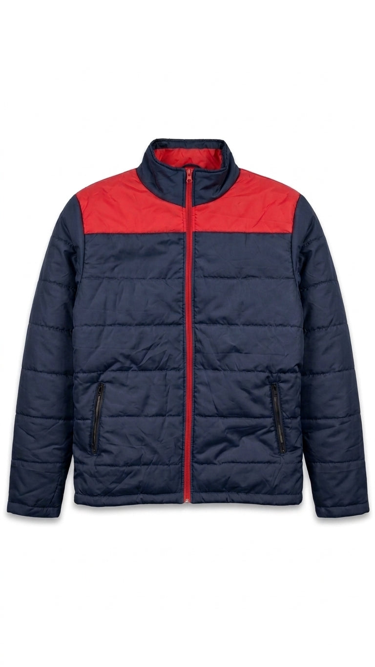 A navy blue puffer jacket with a contrasting red yoke across the chest and collar, featuring a full-length red zipper and zippered hand pockets, shown against a plain white background.