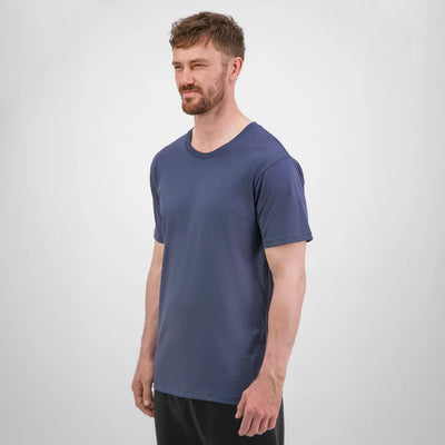 Man wearing a blue t-shirt against a white background