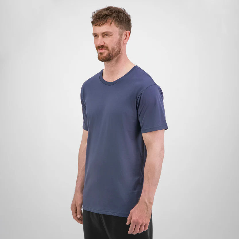 Man wearing a blue t-shirt against a white background