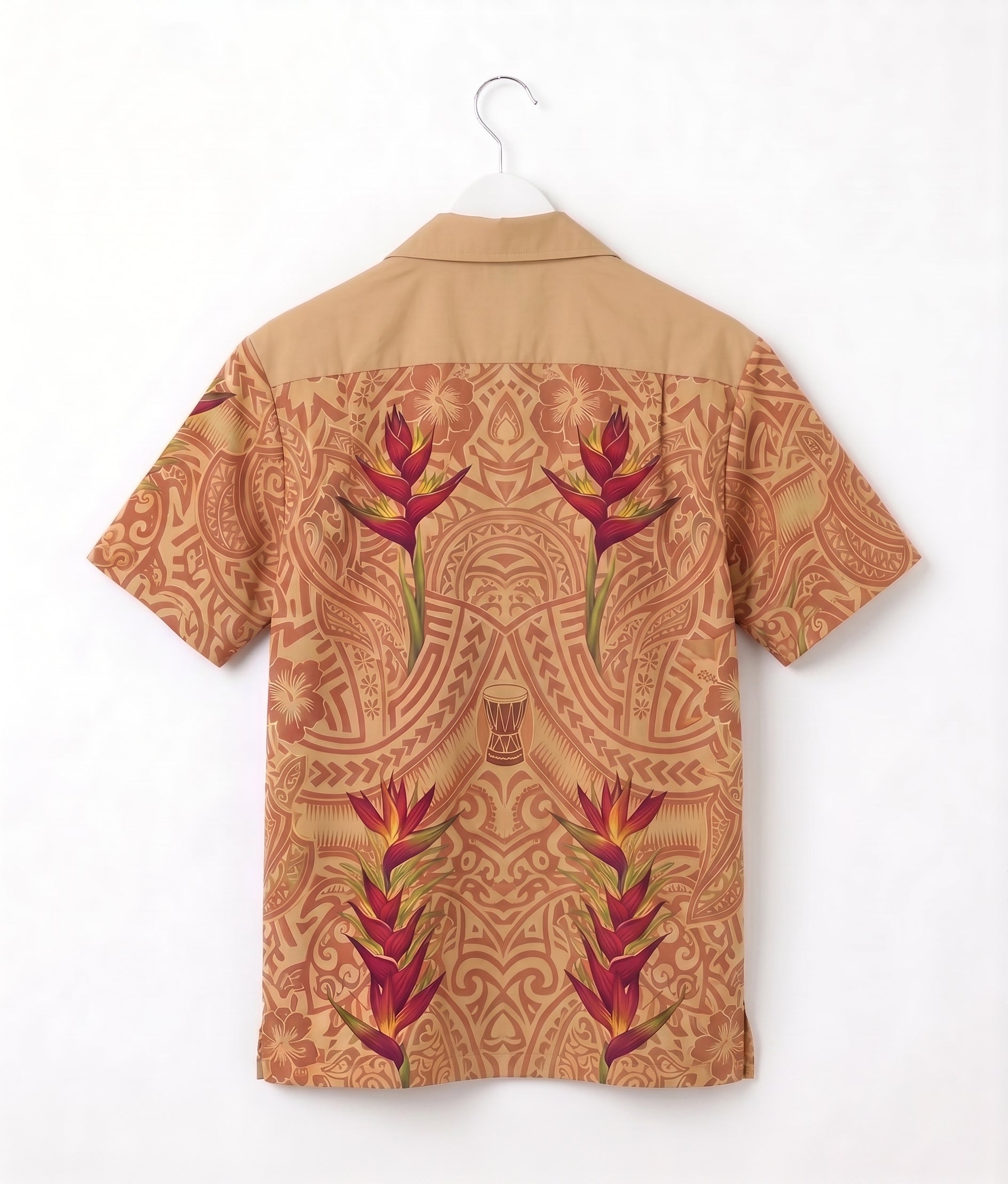 A short-sleeve camp collar shirt shown from the back, hanging on a white hanger against a plain white wall. The shirt features a tan base with a detailed brown tribal-style pattern and large red and green tropical flower motifs.