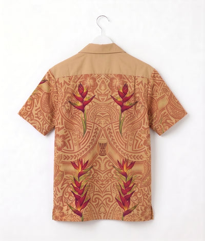 A short-sleeve camp collar shirt shown from the back, hanging on a white hanger against a plain white wall. The shirt features a tan base with a detailed brown tribal-style pattern and large red and green tropical flower motifs.