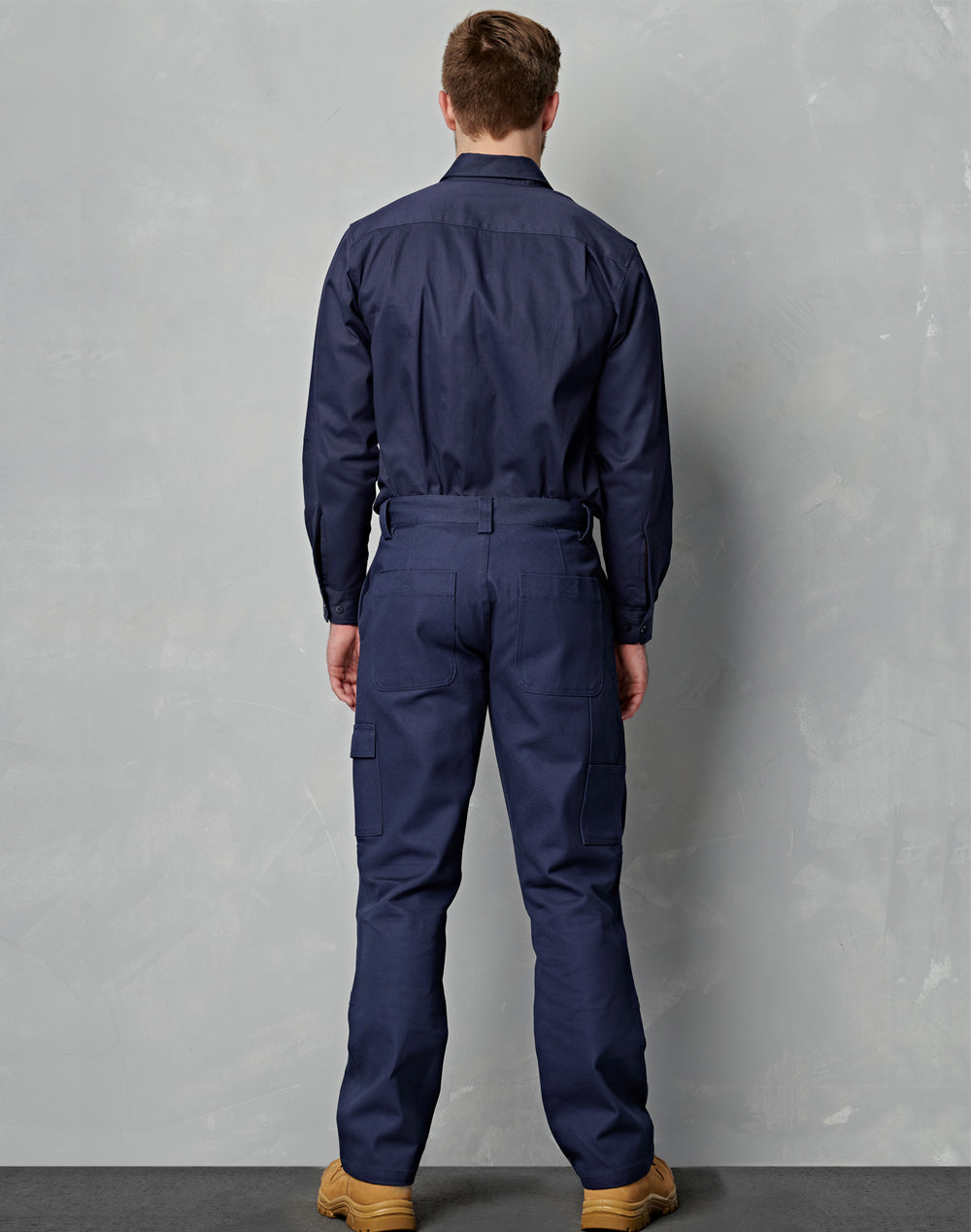Navy blue heavy drill workwear coverall with cargo pockets button-up collar ideal for durable work uniforms