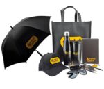 Black umbrella with gold logo from custom promotional gift set perfect for uniforms and workwear use