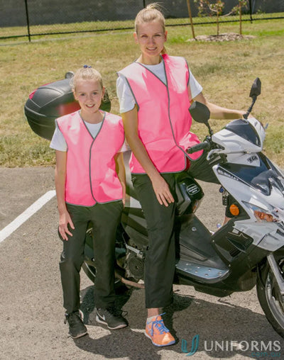 Two people in pink AIW Kids Safety Vests with scooter, showing winning spirit sw02k
