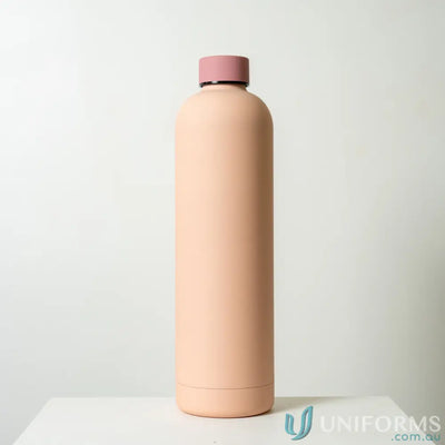 Peach-colored stainless steel Allegra 1L insulated water bottle with pink lid for car cup holders