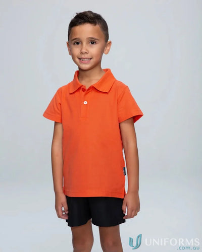 Young boy in Hunter Kids Pique Knit Polo shirt, perfect for uniforms or casual workwear