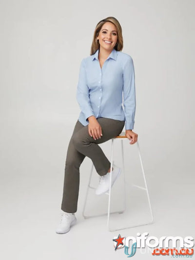 Woman in light blue long sleeve city stretch uniform shirt and khaki pants