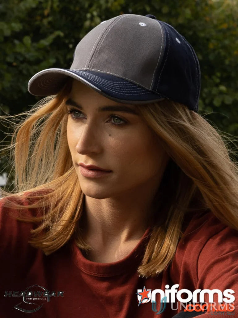 Woman wearing Contrasting Stitching Cap with two-tone gray and navy blue design