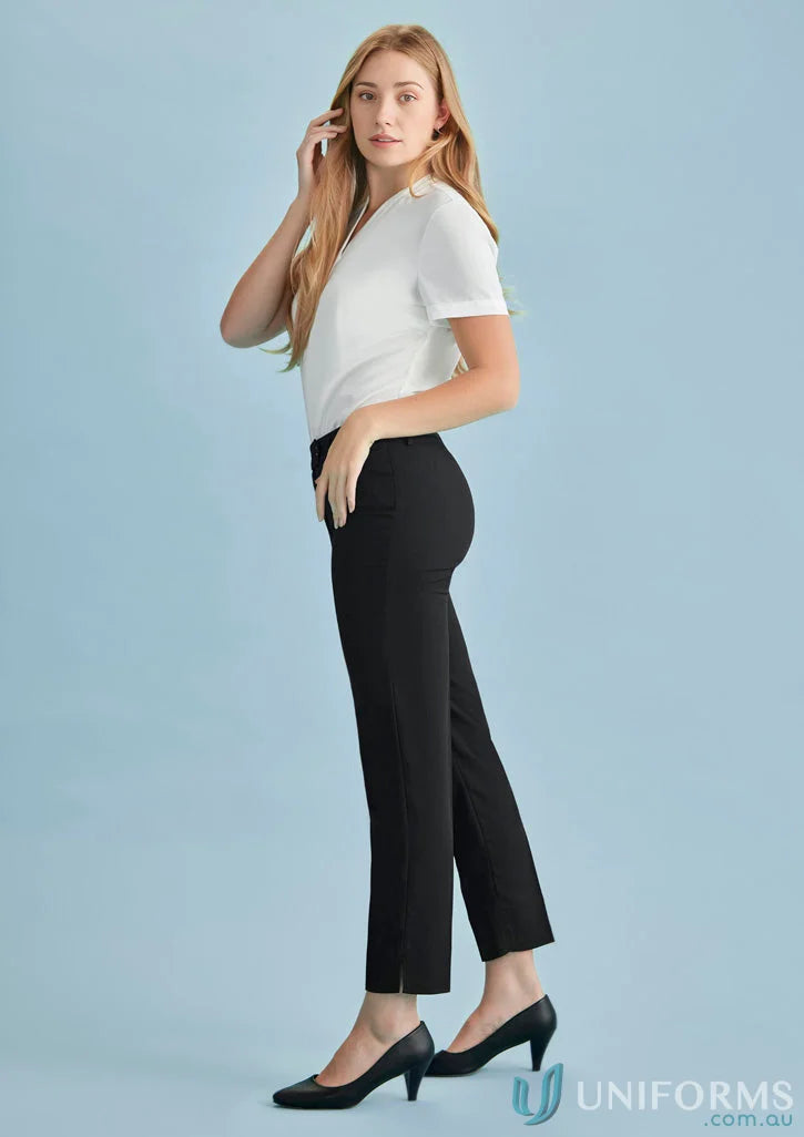Woman in black cool stretch slim leg pants and white top for womens cool style