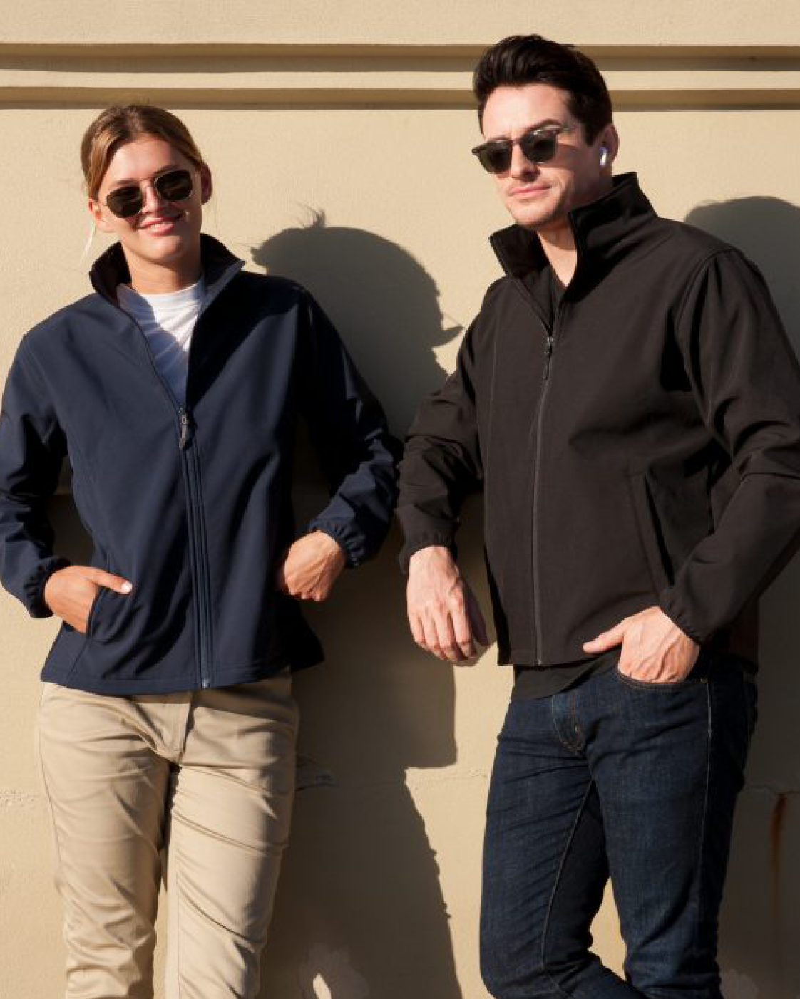 Navy blue and black alta softshell zip-up jackets made for durable work uniforms and comfortable workwear options