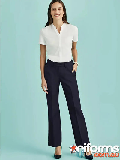 Lady wearing CR Ladies Relaxed Fit Straight Leg Pant in white shirt and navy pants