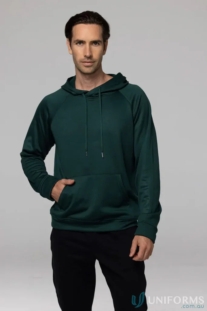 Man in green hoodie and black pants showcasing Crusader Fleece for comfortable fit