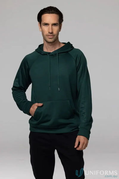 Man in a green Crusader Fleece Hoodie and black pants showing comfortable fit