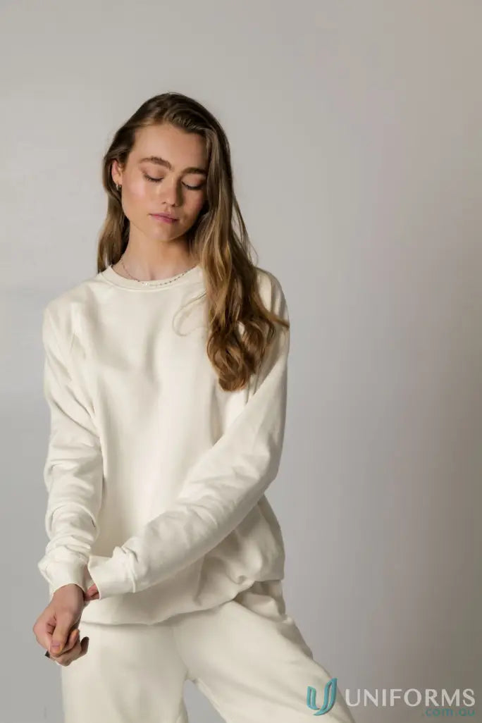 Woman in Archie Crew Sweat Natural with matching unbrushed french terry sweatshirt and sweatpants