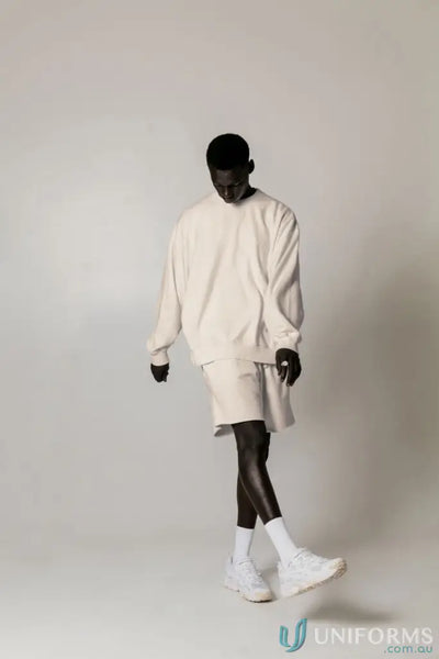 Man in matching Retro Sweat Natural Dyed oversized drop shoulder sweatshirt and shorts