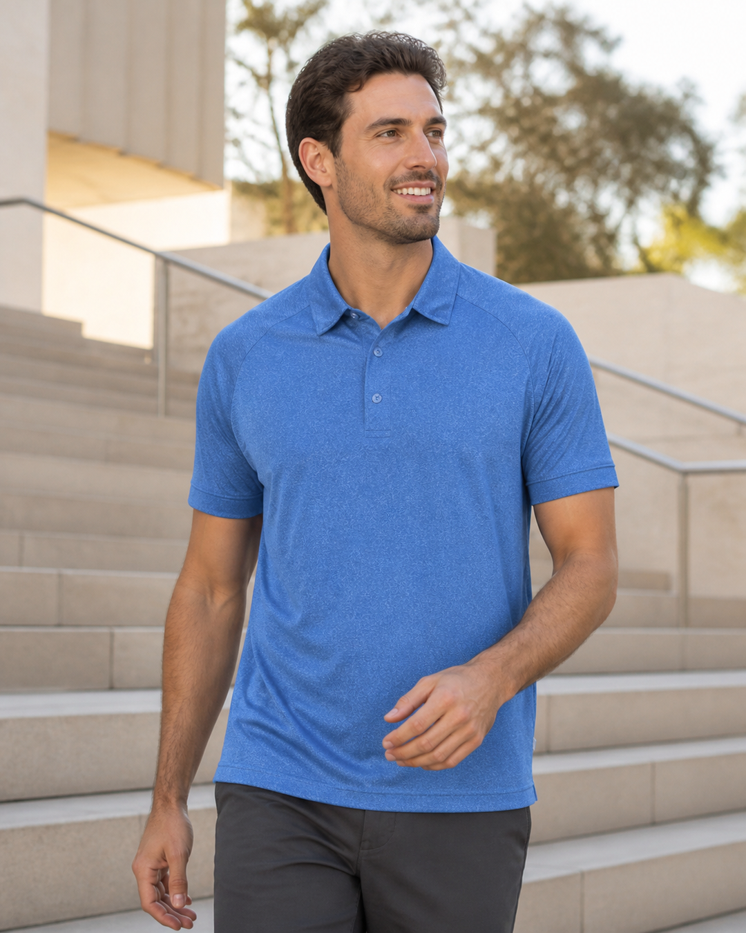 Mediterranean Australian male model wearing royal blue Dri Gear Melange Polo