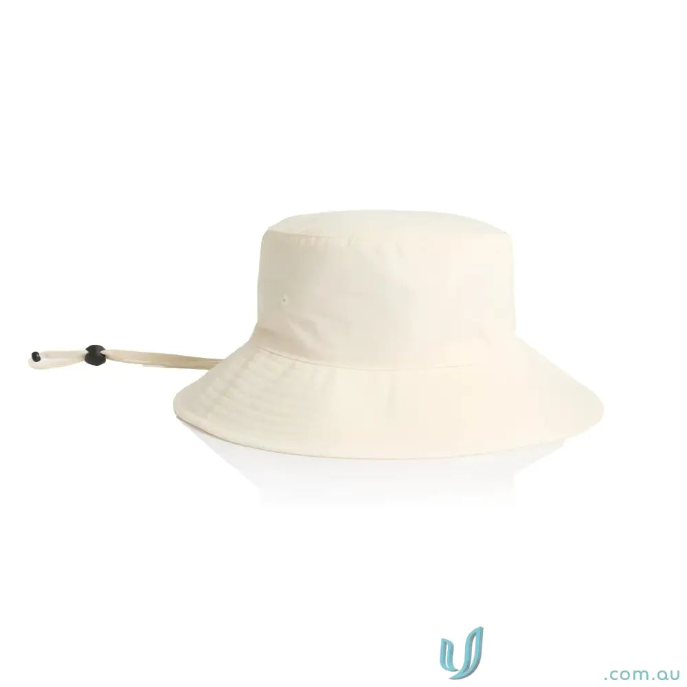 Cream-colored durable nylon wide brim bucket hat with adjustable chin strap