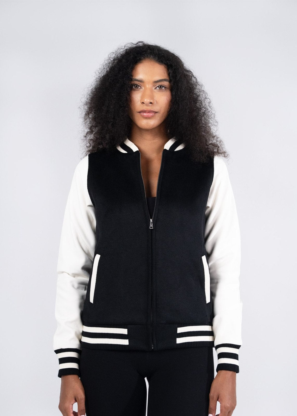 Black and white varsity wool blend ladies jacket with ribbed cuffs perfect for stylish workwear and uniforms