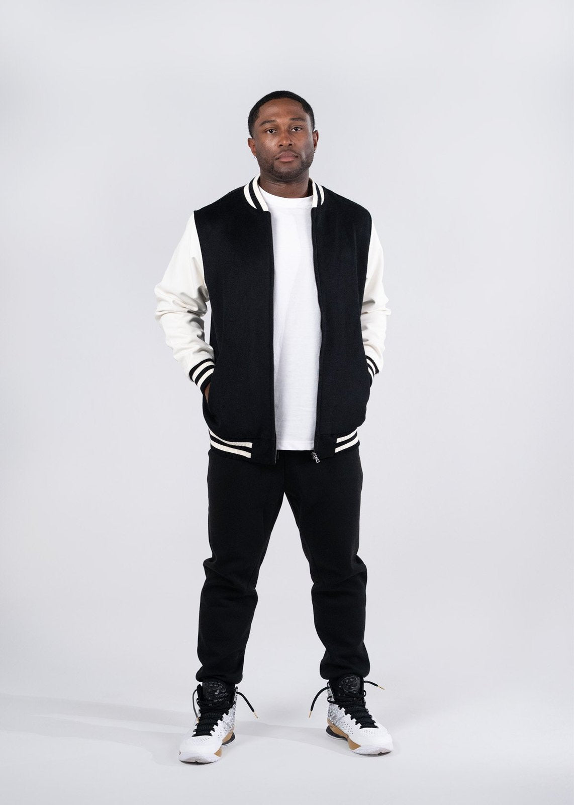 Black and white varsity wool blend jacket with ribbed collar and cuffs perfect for workwear or work uniforms