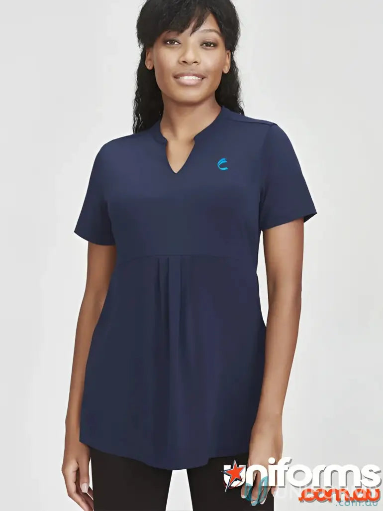 Woman wearing FMIG EMB Ladies Easy Fit Top in dark blue, perfect for uniforms or workwear