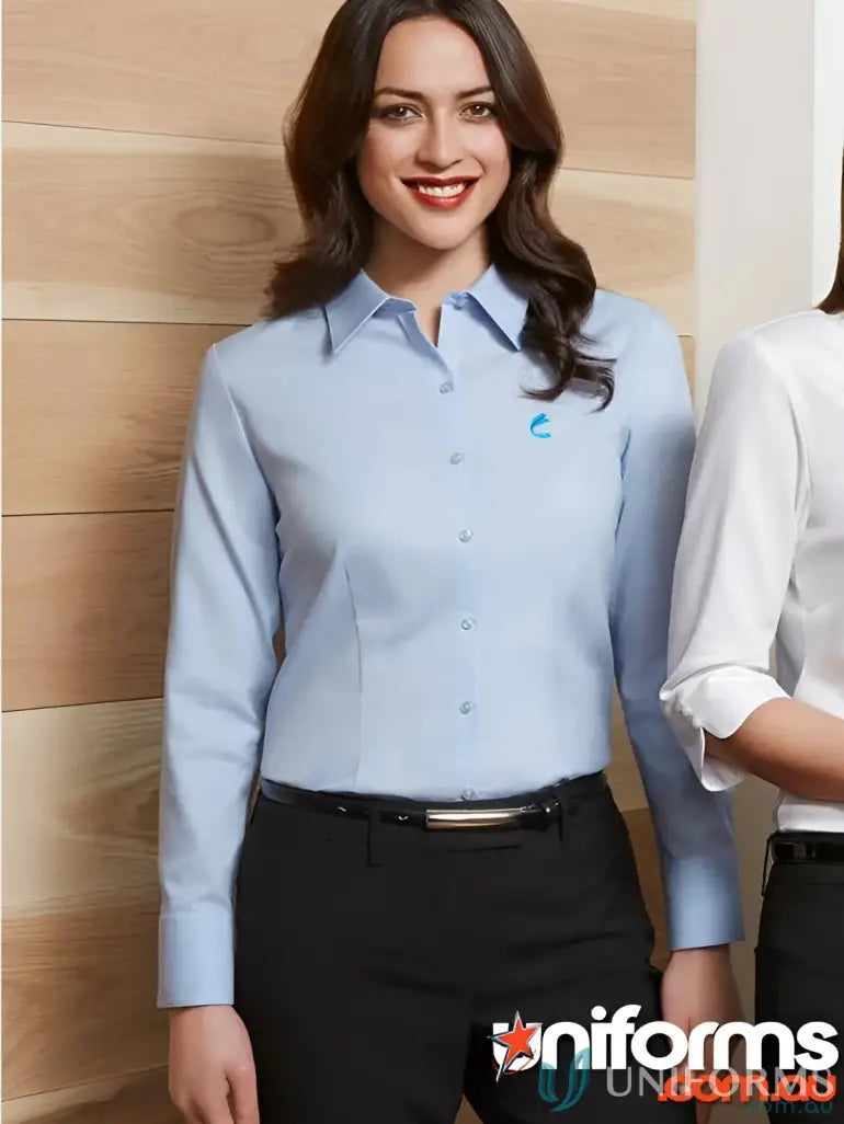 Woman in light blue FMIG EMB Ladies Premium Cotton LS Shirt for work uniforms