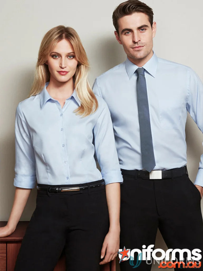Two people in light blue mini herringbone cotton shirts perfect for work environments or uniforms